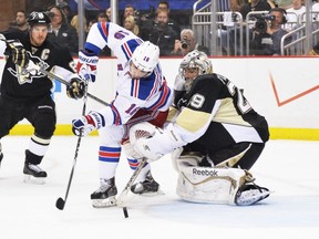 PITTSBURGH, PA - MAY 9:  Derick Brassard #16 of the New York Rangers scores a goal on goaltender Marc-Andre Fleury #29 of the Pittsburgh Penguins in the first period in Game Five of the Second Round of the 2014 NHL Stanley Cup Playoffs on May 9, 2014 at CONSOL Energy Center in Pittsburgh, Pennsylvania.  (Photo by Jamie Sabau/Getty Images)