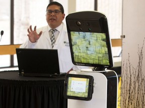 Dr. Ivar Mendez introduces robot Patrick at the Royal University Hospital on Monday.