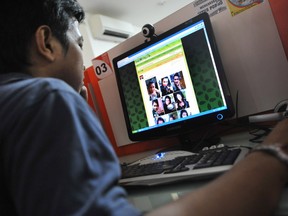 A man browses at pictures of Japanese porn star Maria Ozawa .