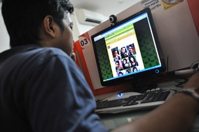 A man browses at pictures of Japanese porn star Maria Ozawa .