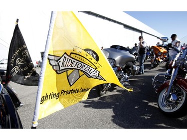 A flag hangs of the back a motorcycle at the Ottawa TELUS Motorcycle Ride for Dad at the Canadian Aviation and Space Museum on Saturday May 31, 2014.