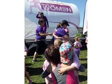 A little girl hugs her mom before the 1k run for little ones at the Shoppers Drug Mart Run for Women on Sunday, May 11, 2014 near the Aviation Museum. The 5K. 10K, and 1k for children helps raise money for Women's Mental Health programs in race cities, such as Royal Ottawa.