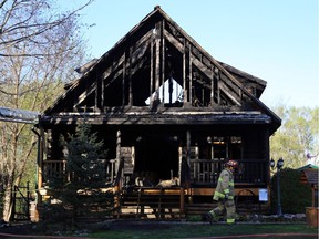 An early morning fire completely gutted a log home at 65 Lennox St. in Richmond, May 18, 2014.