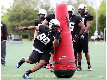 Bernard Smith goes through defensive drills during the opening day for the Ottawa RedBlacks rookies training camp, May 28, 2014.