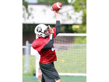 Brandon Bialkowski throws the football during the opening day for the RedBlacks rookies training camp, May 28, 2014.