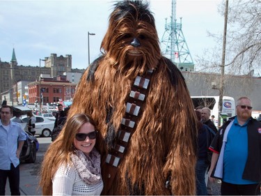 Chewbacca poses with Pauline Weir who was passing by as Ottawa Comiccon, which begins Friday at the EY Centre, held a press conference at Brother's Beer Bistro in the Byward Market. Photo taken on May 8, 2014.