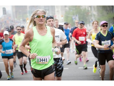 Colin Geddis runs up Elgin Street at the beginning of the marathon during Ottawa Race Weekend Sunday May 25, 2014.