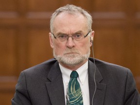 Auditor General of Canada Michael Ferguson waits to appear at House Standing Committee on Public Accounts committee Wednesday November 27, 2013 in Ottawa. THE CANADIAN PRESS/Adrian Wyld