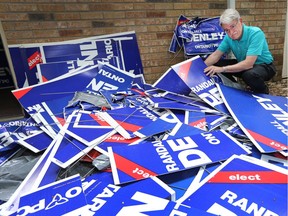 Conservative candidate in Ottawa-West Nepean Randall Denley, surveys some of the more than 100 lawn signs that were destroyed over the weekend in what seems to be a targeted campaign. Many were cut up with a knife or blade of some sort.  Photo taken at 13:25 on May 26, 2014.