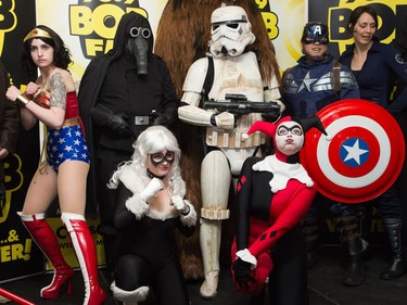 Cosplayers strike a pose as Ottawa Comiccon, which begins Friday at the EY Centre, held a press conference at Brother's Beer Bistro in the Byward Market. Photo taken on May 8, 2014.