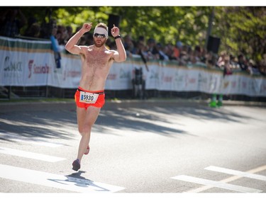 David Jeker comes running into the finish line of the marathon at Ottawa Race Weekend Sunday May 25, 2014.