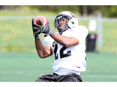 Eric O'Neal makes a catch during the opening day for the RedBlacks rookies training camp, May 28, 2014.