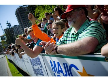 Fans and supporters line the race route to cheer on the runners during Ottawa Race Weekend Sunday May 25, 2014.