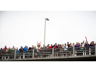 Fans line the Laurier bridge at Ottawa Race Weekend Sunday May 25, 2014.