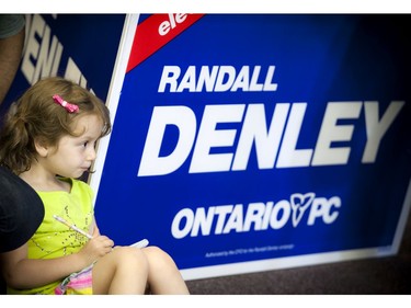 Four year old Lily Giorno takes notes before Randall Denley, Ontario PC candidate for Ottawa West-Nepean, rally kicked off at his campaign office Saturday May 24, 2014.