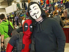 Francois Houle, left, as Dead Pool and Alexandre Williot as V attended the opening day of Comiccon in Ottawa on May 09, 2014.