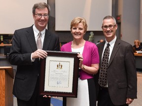 Susan MacLatchy receives the Mayor's City Builder Award from Mayor Jim Watson, left, and Coun. Keith Egli.