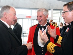 From left, Defence Minister Rob Nicholson in conversation with Lt-Gen. Guy Thibault, Vice Chief of the Defence Staff, and Vice Admiral Mark Norman, Commander of the Royal Canadian Navy, at the Battle of the Atlantic Gala Dinner held Thursday, May 1, 2014, at the Canadian War Museum. Photo by Caroline Phillips 116110