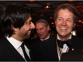 From left, Jian Ghomeshi shares a laugh with singer-songwriter Jim Cuddy of Blue Rodeo at the Governor General's Performing Arts Awards Gala held Saturday, May 10, 2014, at the National Arts Centre.