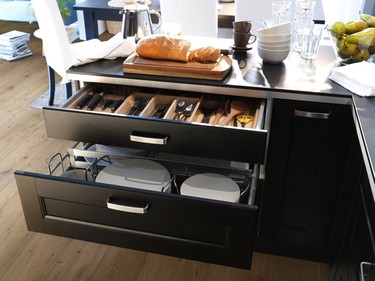 By design: Pot drawers and drawer dividers are more efficient in the kitchen.