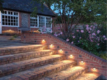 Outdoor lighting trends include recessed lighting in stone walls and stairs.