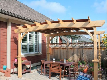 A pergola is designed to provide shade, like this custom-made eastern white cedar one from Lanark Cedar with a fabric cover from Costco.