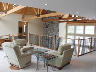 Originally mean to be a third bedroom, the loft in the Johnson home gives an up-close view of the Douglas fir trusses and knotty pine ceiling.