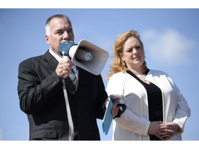 General Manager of the Greater Ottawa Truckers Association, Ron Barr speaks to the crowd at the protest where147 Trucks and many supporters gathered at the Canadian Tire Centre parking lot to protest against the city on Saturday, May 10, 2014.