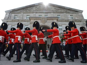 Guards march during the annual inspection of the Ceremonial Guard at Rideau Hall in Ottawa on Thursday, June 20, 2013.