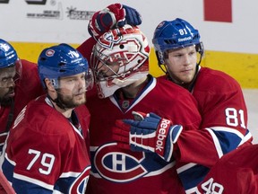 Montreal Canadiens' P.K. Subban (left to right), Andrei Markov, Carey Price and Lars Eller, celebrate their victory over the Boston Bruins in NHL playoff hockey action on Monday, May 12, 2014 in Montreal. THE CANADIAN PRESS/Paul Chiasson