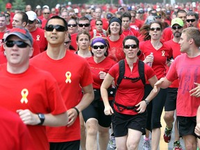 It was a sea of red on Colonel By Drive Friday at 1 p.m. as runners and walkers of all age and ability from the Canadian Armed Forces, DND and other non-government groups participated in the Canadian Forces Day Walk/Run in Red 2014.  It is the eighth year of the event, which included an eight-kilometre run and three-kilometre walk to show support for Canadian Forces.  (Julie Oliver / Ottawa Citizen)