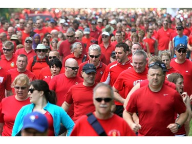 It was a sea of red on Colonel By Drive Friday at 1 p.m. as runners and walkers of all age and ability from the Canadian Armed Forces, DND and other non-government groups participated in the Canadian Forces Day Walk/Run in Red 2014.  It is the eighth year of the event, which included an eight-kilometre run and three-kilometre walk to show support for Canadian Forces.  (Julie Oliver / Ottawa Citizen)