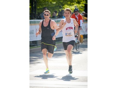 Joe Boland ran the first 5km and last 5km of the marathon with Tommy Desbrisay who is autistic and finished the marathon at Ottawa Race Weekend Sunday May 25, 2014.