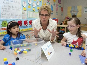 Ontario Liberal leader Kathleen Wynne sits with school children during a campaign stop in Markham, Ontario on Wednesday May 28, 2014, 2014.