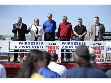 (L-R) General Manager of the Greater Ottawa Truckers Association, Ron Barr, MPP Lisa MacLeod, MPP John Yakabuski, MPP Jack McLaren, Head of Independent Electrician Doug Letch, and Mayoral candidate Mike Maguirej attends the protest where147 Trucks and many supporters gathered at the Canadian Tire Centre parking lot to protest against the city on Saturday, May 10, 2014.
