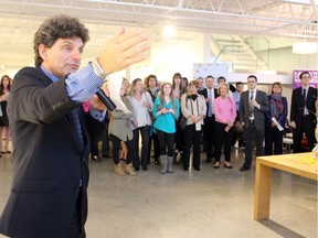 Lawrence Greenspon volunteered as charity auctioneer at the Spring Blooms fundraiser for Candlelighters, held Wedneseday, April 30, 2014, at Koyman Galleries.