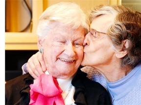 Bette Haining is a 94-year-old widower who just loves living at Unitarian House. “I just feel safe here,” she says. “And I’ve so many good friends.”  Bette Haining erupts in laughter as friend Kay Walker plants a smooch on her during a Tuesday morning cooking class at Unitarian House of Ottawa. Unfortunately, there is not enough seniors housing like Unitarian House, and the shortage will worsen as baby boomers age.