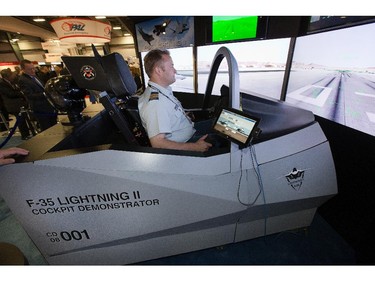 Major Donald Couzens checks out the F35 cockpit simulator as the annual trade fair for military equipment known as CANSEC took place at the EY Centre near the airport.