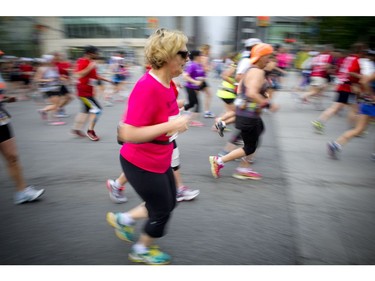 Marathon runners along Elgin Street during Ottawa Race Weekend Sunday May 25, 2014.