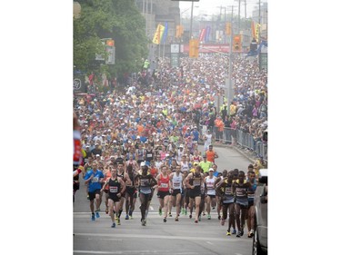 Marathoners start the race up Elgin Street during Ottawa Race Weekend Sunday May 25, 2014.