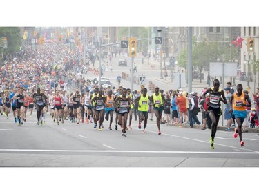 Marathoners start the race up Elgin Street during Ottawa Race Weekend Sunday May 25, 2014.