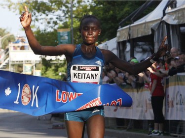 Mary Keitany, the top woman finisher, crosses the finish line at the 10k race during the Ottawa Race Weekend on Saturday May 24, 2014. (Patrick Doyle / Ottawa Citizen)  ORG XMIT: 0526 ottawa10k26