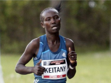 Mary Keitany, the top woman finisher, runs in the 10k race during the Ottawa Race Weekend on Saturday May 24, 2014. (Patrick Doyle / Ottawa Citizen)  ORG XMIT: 0526 ottawa10k23