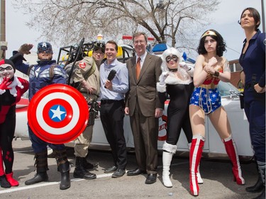 Mayor Jim Watson and Councillor  Mathieu Fleury (both centre) pose with cosplayers as Ottawa Comiccon, which begins Friday at the EY Centre, held a press conference at Brother's Beer Bistro in the Byward Market. Photo taken on May 8, 2014.