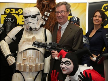 Mayor Jim Watson poses with cosplayers as Ottawa Comiccon, which begins Friday at the EY Centre, held a press conference at Brother's Beer Bistro in the Byward Market. Photo taken on May 8, 2014.