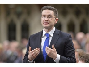 Pierre Poilievre speaks during question period in the House of Commons on Parliament Hill in Ottawa, Thursday May 1, 2014 .