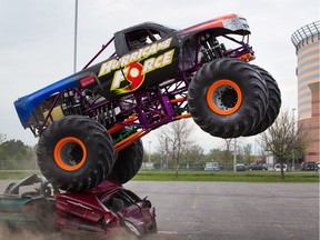 Monster trucks drive over vehicles in preparation for the event to be held on Saturday at Canadian Tire Centre. The demonstration suggests it could be one way of getting out of the parking lot on Senators game night.