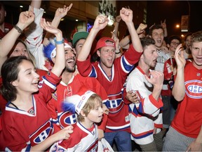 Montreal Canadiens fans celebrate their team's NHL playoff win over the Boston Bruins in Montreal Wednesday May 14, 2014.