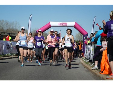 Mothers, daughters, and other family and friends take part in the Shoppers Drug Mart Run for Women on Sunday, May 11, 2014 near the Aviation Museum. The 5K. 10K, and 1k for children helps raise money for Women's Mental Health programs in race cities, such as Royal Ottawa.