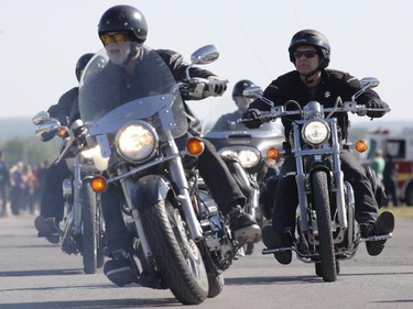 Motorcyclists ride in the Ottawa TELUS Motorcycle Ride for Dad at the Canadian Aviation and Space Museum on Saturday May 31, 2014.